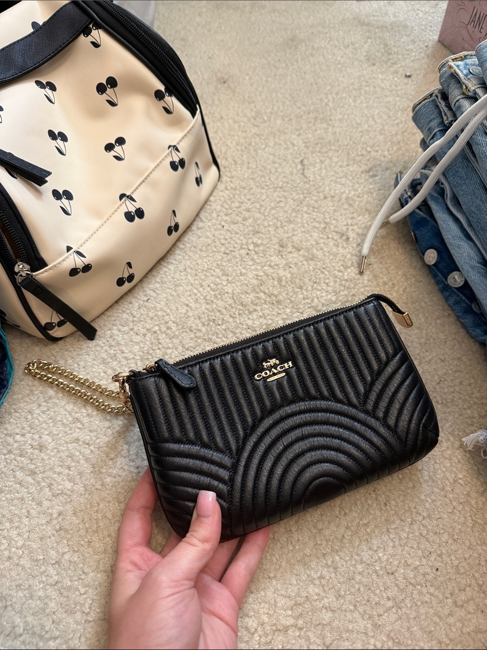 COACH Black Quilted Leather Wristlet with Gold Chain Accent